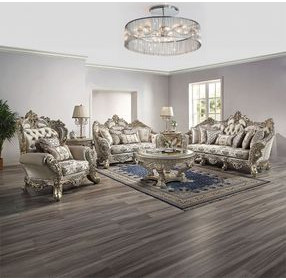 Danae Champagne and Gold Upholstered Lounge Chair with Pillows and Nailhead trim